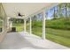 Back porch with ceiling fan and wooded views at 1868 Lacebark Elm Way, Lawrenceville, GA 30045
