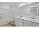 Bathroom with shower, double vanity, and a large mirror at 1868 Lacebark Elm Way, Lawrenceville, GA 30045