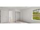 Bedroom with a large window and walk in closet at 1868 Lacebark Elm Way, Lawrenceville, GA 30045