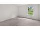 Bedroom with carpet and a bright window at 1868 Lacebark Elm Way, Lawrenceville, GA 30045