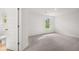 Bedroom with neutral walls, carpet, and attached bathroom at 1868 Lacebark Elm Way, Lawrenceville, GA 30045