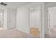 Hallway with neutral carpet and white doors at 1868 Lacebark Elm Way, Lawrenceville, GA 30045