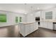 Bright kitchen featuring a center island, stainless appliances, and granite countertops at 1868 Lacebark Elm Way, Lawrenceville, GA 30045