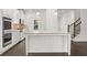 Well-equipped kitchen features an island, modern appliances, and hardwood floors at 1868 Lacebark Elm Way, Lawrenceville, GA 30045