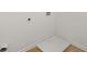 Laundry room with vinyl flooring and hook ups at 1868 Lacebark Elm Way, Lawrenceville, GA 30045