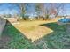 Fenced backyard featuring grassy areas, a small patio with a dining set, and a shed for storage at 2976 Emory Se Rd, Smyrna, GA 30080