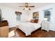 Inviting bedroom with hardwood floors, two windows, a ceiling fan, and neutral decor create a relaxing atmosphere at 2976 Emory Se Rd, Smyrna, GA 30080