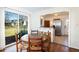 Bright breakfast nook features a wood table, backyard views, and easy access to the kitchen with stainless steel appliances at 2976 Emory Se Rd, Smyrna, GA 30080