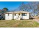 Charming white brick home featuring a well-maintained lawn and inviting front porch at 2976 Emory Se Rd, Smyrna, GA 30080
