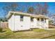 Charming white brick home featuring a well-maintained lawn and inviting front porch at 2976 Emory Se Rd, Smyrna, GA 30080