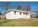 Charming white brick home featuring a well-maintained lawn and inviting front porch at 2976 Emory Se Rd, Smyrna, GA 30080
