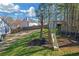 Large backyard with play set, grassy area and wood fence at 115 Trelawney Cir, Covington, GA 30016