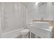 Contemporary bathroom featuring a sleek vanity and shower-tub combo at 115 Trelawney Cir, Covington, GA 30016