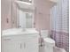 Bathroom featuring a single vanity, sink, toilet, and shower with polka dot curtain at 115 Trelawney Cir, Covington, GA 30016