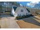 Side view of a charming house with an attached garage and a well-kept lawn at 115 Trelawney Cir, Covington, GA 30016