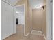 Hallway with closet and doorway to bedroom, and staircase with hardwood steps at 115 Trelawney Cir, Covington, GA 30016