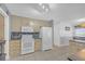 Bright kitchen features white appliances, stylish backsplash, and tile flooring at 115 Trelawney Cir, Covington, GA 30016