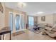 Inviting foyer with stylish door, soft lighting, and comfortable seating area with neutral tones at 115 Trelawney Cir, Covington, GA 30016
