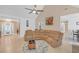 Bright living room with a large sectional couch, vaulted ceiling, and modern decor at 115 Trelawney Cir, Covington, GA 30016