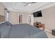 Large main bedroom featuring a tray ceiling and neutral color palette at 115 Trelawney Cir, Covington, GA 30016