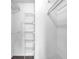 Organized walk-in closet featuring metal shelving for efficient storage at 1406 River Green Nw Dr, Atlanta, GA 30327