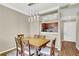 Dining room with modern light fixture and view into kitchen area at 1406 River Green Nw Dr, Atlanta, GA 30327