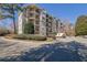Beautiful condo complex with brick driveway and mature landscaping at 1406 River Green Nw Dr, Atlanta, GA 30327