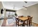 Inviting living room with bright natural light, a dining area and hardwood floors at 1406 River Green Nw Dr, Atlanta, GA 30327