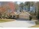 This aerial view showcases a single-story house with a long driveway and convenient two-car garage at 2090 Walden Park, Snellville, GA 30078