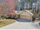 This aerial view highlights a single-story home, its two-car garage, and a shed on the property at 2090 Walden Park, Snellville, GA 30078