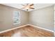 Bedroom with hardwood floors, window, and light neutral walls at 2090 Walden Park, Snellville, GA 30078