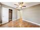 Bedroom features hardwood floors, ceiling fan and closet at 2090 Walden Park, Snellville, GA 30078