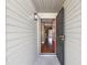 View of an open entryway with dark wood floors and a view through to the living room at 2090 Walden Park, Snellville, GA 30078
