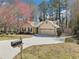 Lovely single-story home with a mailbox near the paved driveway that leads to the two-car garage at 2090 Walden Park, Snellville, GA 30078