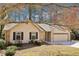 Attractive single-story home featuring stone accents and a convenient two-car garage at 2090 Walden Park, Snellville, GA 30078