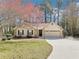 Charming single-story home with stone accents, a two-car garage, and lush landscaping at 2090 Walden Park, Snellville, GA 30078