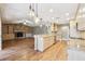 Open concept kitchen with stainless steel appliances and an island overlooking the living room at 2090 Walden Park, Snellville, GA 30078
