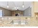 Open kitchen view with stainless steel sink and a view of the living room with a fireplace at 2090 Walden Park, Snellville, GA 30078