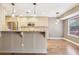 Spacious kitchen featuring granite countertops, stainless steel appliances, and beautiful hanging lights at 2090 Walden Park, Snellville, GA 30078