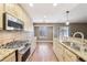 Spacious kitchen with gas range and stainless steel appliances with bar seating area at 2090 Walden Park, Snellville, GA 30078