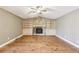 Comfortable living room with a fireplace and built-in bookshelves, perfect for relaxing and entertaining at 2090 Walden Park, Snellville, GA 30078