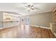 Open-concept living area with hardwood floors, views of the kitchen, and sliding doors to an outdoor space at 2090 Walden Park, Snellville, GA 30078