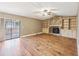 Spacious living area with access to outdoor patio and features a stone fireplace and custom shelving at 2090 Walden Park, Snellville, GA 30078