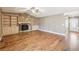 Inviting living room with hardwood floors and a stone fireplace, flanked by custom shelving and cabinetry at 2090 Walden Park, Snellville, GA 30078