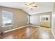 Bright main bedroom with hardwood floors, neutral walls, and an ensuite bathroom featuring a large mirror at 2090 Walden Park, Snellville, GA 30078