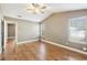 Bright main bedroom with hardwood floors, neutral walls, and two windows offering natural light at 2090 Walden Park, Snellville, GA 30078