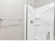 Bathroom with white shower and glass door; towel rack on the wall at 2090 Walden Park, Snellville, GA 30078