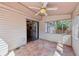 The back sunroom features neutral walls, tile floors, and a ceiling fan at 2090 Walden Park, Snellville, GA 30078