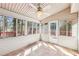 The sunroom features neutral walls, tile floors, and windows to the backyard at 2090 Walden Park, Snellville, GA 30078