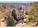 Expansive brick home with mature trees and landscaping, nestled in a serene, wooded setting at 3832 Wesley Chapel Rd, Marietta, GA 30062
